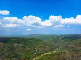 A view of a valley and mountains from a high point photo