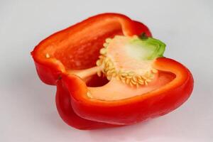 Close Up of a Halved Red Bell Pepper with Seeds photo