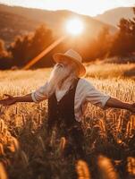 Elderly man in sunlit wheat field photo