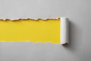 Colorful yellow torn paper background with copy space photo