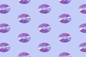 Database multimedia disk computer pattern on purple velvet background. photo
