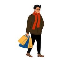 Young man walks with shopping bags in casual attire during winter stroll vector