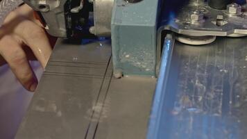 Close up of working circular saw with flying drops of water. Creative. Industrial cutting machine. video