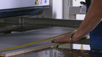 Carpenter makes measurements. at his work place. Creative. Concept of carpentry, craftsmanship, handwork. video
