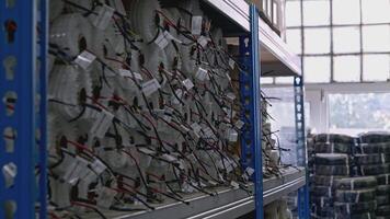 Stock of rolls on storage shelves. Creative. Insulation material in rolls at the warehouse. video