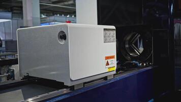 Automated laser cutting machine for metal pipes. Media. Moving machine on rails of industrial conveyor. Automated laser machine moving in industrial workshop video