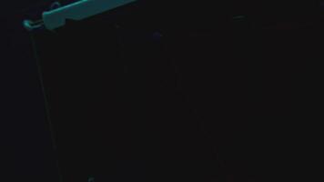 Night office with notes. Stock footage. Light of lantern illuminates inscriptions on stickers with strings in night office. Mysterious stickers with rebus values video