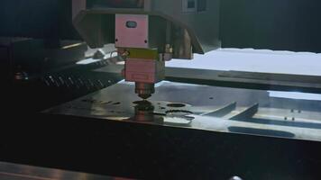 Robotic machine carves patterns on metal. Media. Artificial intelligence in industrial machine with metal thread. Carving on metal plates by industrial machine video