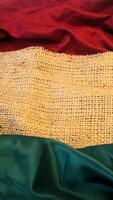 A rustic vintage burlap featuring green and red plain fabric, copy space for minimalist christmas greeting design textured background photo