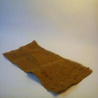 A rustic burlap isolated white background, perfect textured backdrop for showcasing vintage DIY craft products katalog, copy space photo