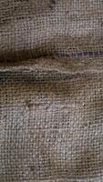 A rustic burlap isolated white background, perfect textured backdrop for showcasing vintage DIY craft products katalog, copy space photo