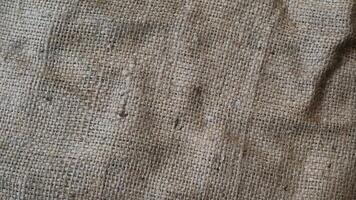 A rustic vintage burlap featuring green and red plain fabric, copy space for minimalist christmas greeting design textured background photo