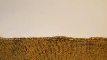 A rustic burlap isolated white background, perfect textured backdrop for showcasing vintage DIY craft products katalog, copy space photo