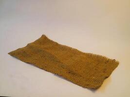 A rustic burlap isolated white background, perfect textured backdrop for showcasing vintage DIY craft products katalog, copy space photo