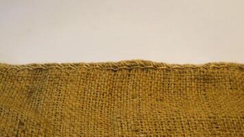 A rustic vintage burlap featuring green and red plain fabric, copy space for minimalist christmas greeting design textured background photo