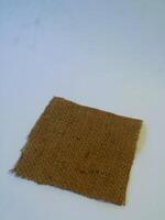 A rustic burlap isolated white background, perfect textured backdrop for showcasing vintage DIY craft products katalog, copy space photo