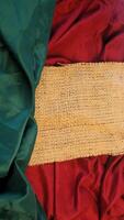 A rustic vintage burlap featuring green and red plain fabric, copy space for minimalist christmas greeting design textured background photo