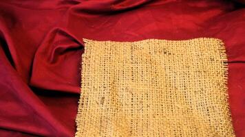A rustic vintage burlap featuring green and red plain fabric, copy space for minimalist christmas greeting design textured background photo
