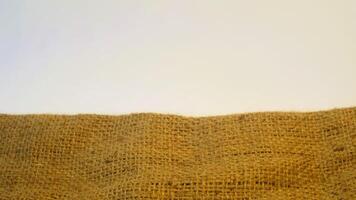 A rustic burlap isolated white background, perfect textured backdrop for showcasing vintage DIY craft products katalog, copy space photo