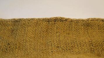 A rustic burlap isolated white background, perfect textured backdrop for showcasing vintage DIY craft products katalog, copy space photo