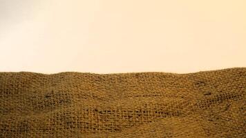 A rustic burlap isolated white background, perfect textured backdrop for showcasing vintage DIY craft products katalog, copy space photo