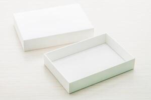 White box on white table with copy space photo