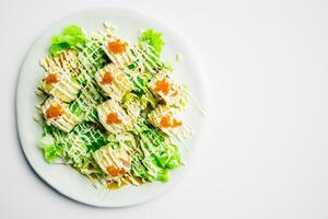 A plate with a salad on top of it photo