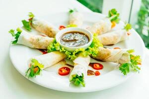 A plate of food with vegetables and sauce photo