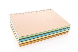 A stack of notebooks on a white background photo