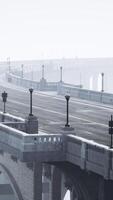 An empty illuminated asphalt road in a thick fog video