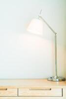 A desk with a lamp on it photo