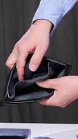 vertical Office worker showing empty wallet, struggling with financial problems, having no money, facing bankruptcy, dealing with expenses and debts while managing paperwork video