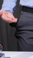 vertical Office worker showing his empty pockets and holding few coins in his hand, representing financial difficulties and economic crisis video