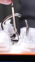 vertical Close-up of an office worker's hand opening a ring binder mechanism to insert or archive documents, showcasing organization and paperwork in a professional setting video