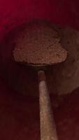 vertical pov first-person view Housekeeper man scoops ash from a fireplace into a metal bucket, efficiently cleaning the area and maintaining a tidy home. The process involves removing dust video