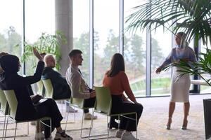 A businesswoman leader guiding a meeting with her colleagues, discussing business challenges, marketing strategies, and new plans for growth and success photo
