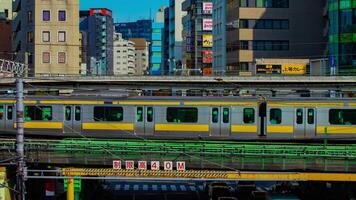 A timelapse of traffic jam at Iidabashi station in Tokyo daytime long shot tilt video