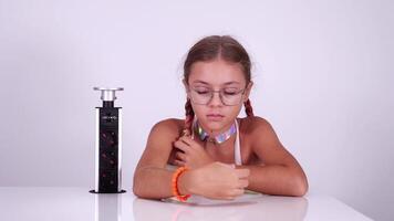 Girl with red blinking eyes charges playing robot in room video