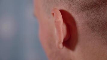 Funny man wiggles ears playing fool close backside view video