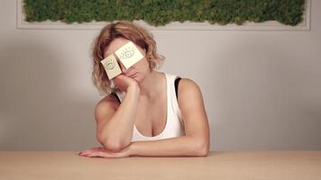 Young woman with stickers of yellow colour on forehead video