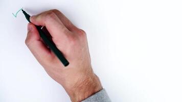 Man draws green check marks on paper with space for template video