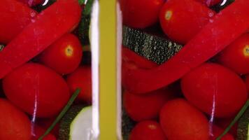 Canned red tomatoes and peppers in glass jars move closeup video