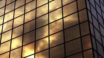Clouds reflect in modern brown building with square windows video
