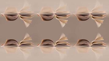 Paper books and reflections with pages turned by strong wind video