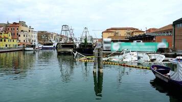 Calm water with large sailboats and reflecting buildings video
