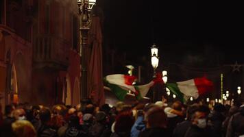 People in protective masks with Italian flags on street video