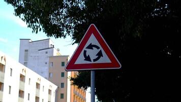 Triangular traffic sign indicating Roundabout car movement video