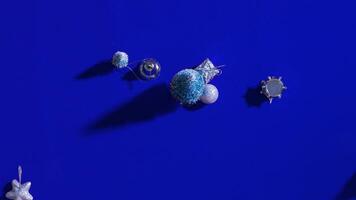 Small Christmas tree decorations move on changing background video