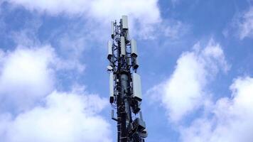 Cell tower with antennas transmits internet signal closeup video