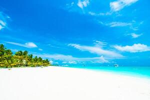A beach with white sand and blue sky photo